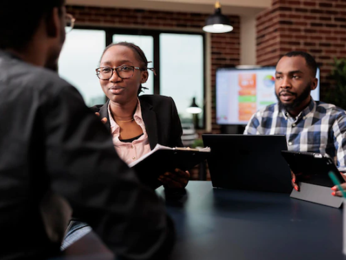 2colleagues-team-working-company-paperwork-doig-teamwork-analyze-documents-online-research-information-planning-corporate-presentation-with-data-charts-job-collaboration